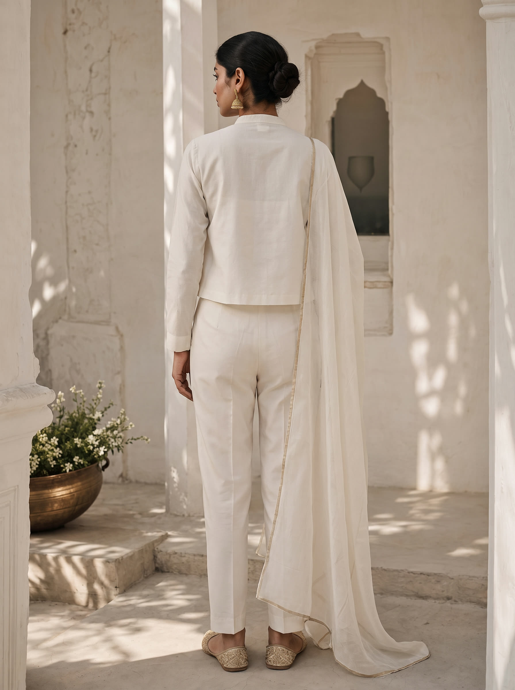 Kora back view — Modern chalk co-ord with a fine line of matte gold marori running along the collar band and the front placket.