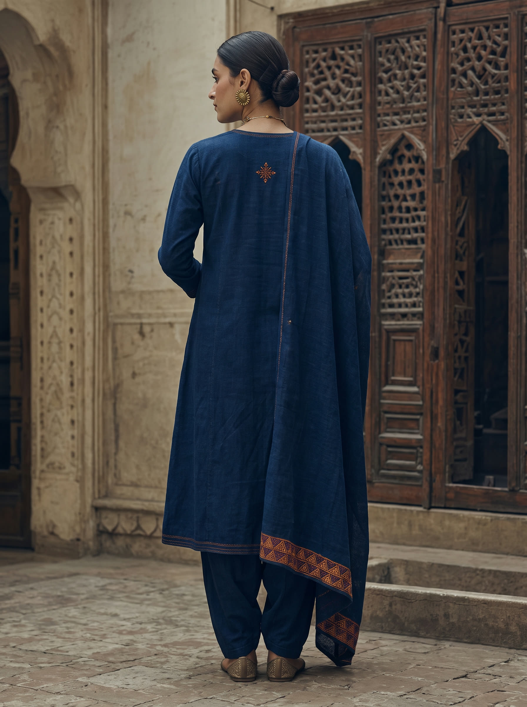 Neel back view — Indigo khaddar under a real counted-stitch phulkari palla — worked back-to-front the honest way.
